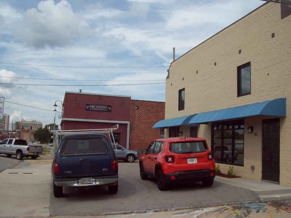     Front of Building w/ 2 Off-Street 
            Parking Spots per Loft