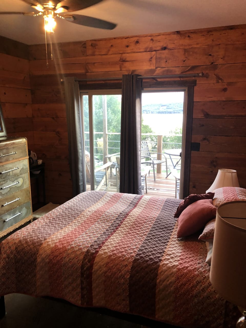 Spacious master with queen bed and sliding patio door access to deck.