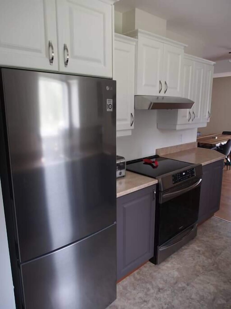 Stainless refrigerator with freezer at the bottom