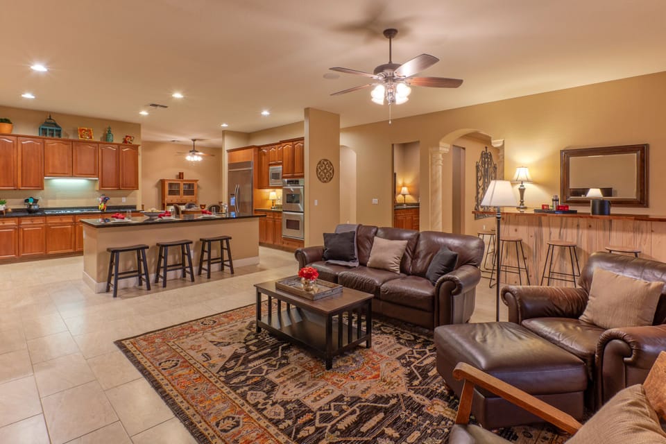 The open concept great room has a large kitchen, sitting area and island.