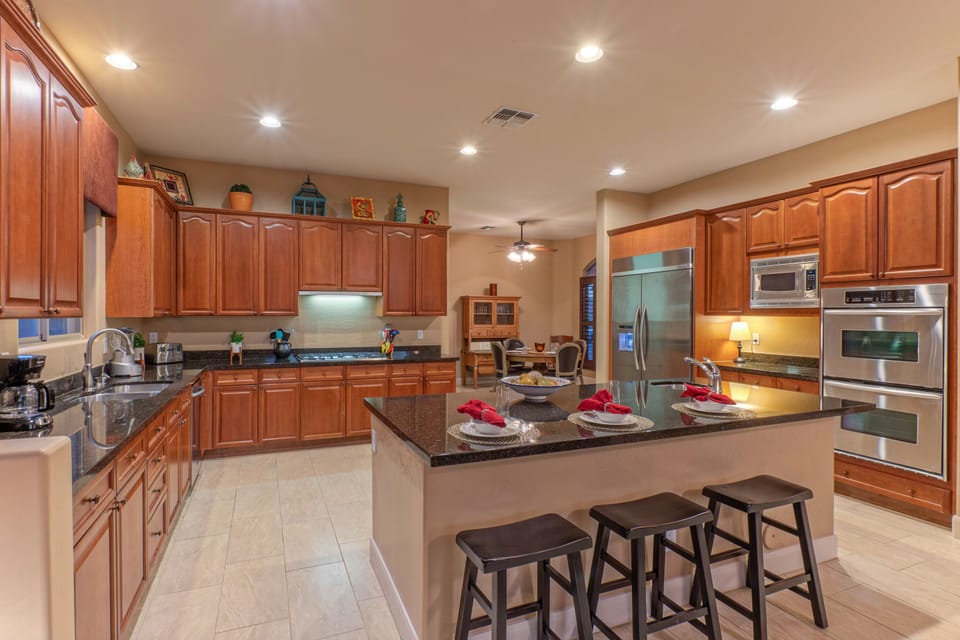 The designer kitchen is completely stocked for prepping and serving home cooked meals.