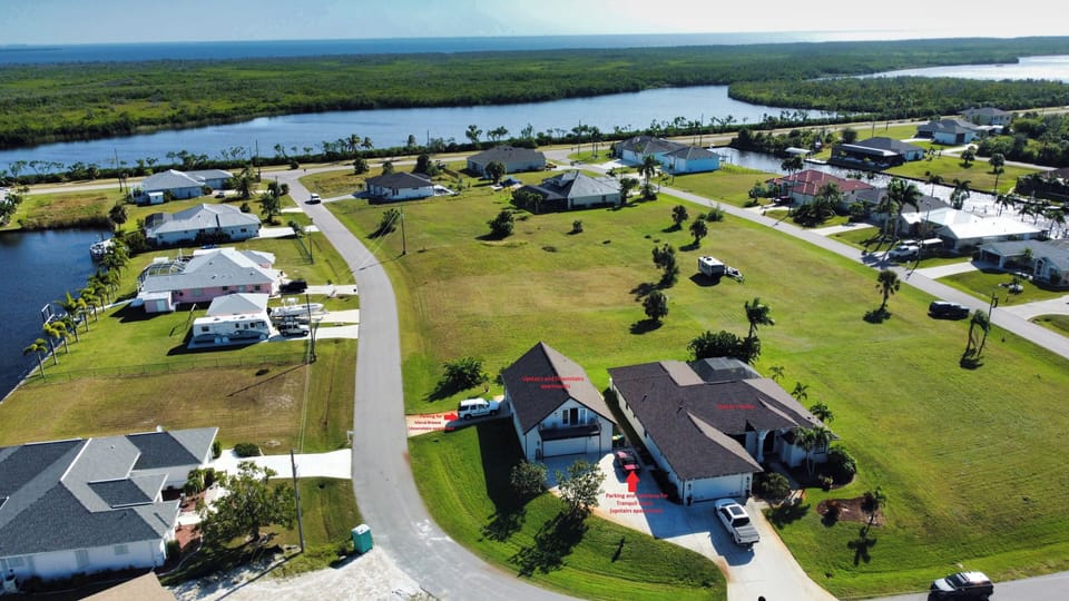 Owner's home (Rt) & apartments (Lt). *Note parking & walkway for Tranquil Oasis.