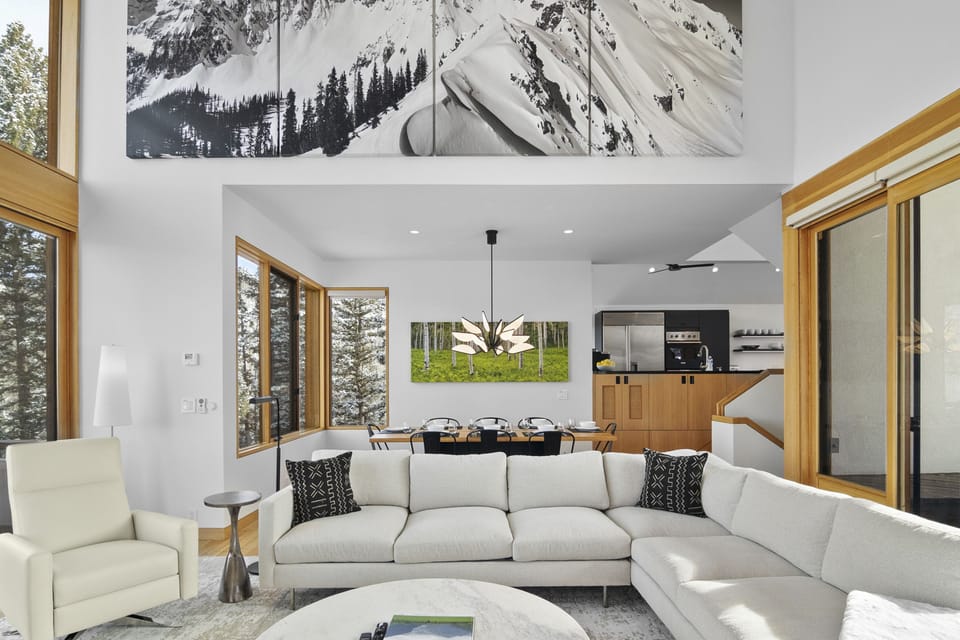 The top floor features a big open living room area with incredible views of the surrounding mountains and electric fireplace.