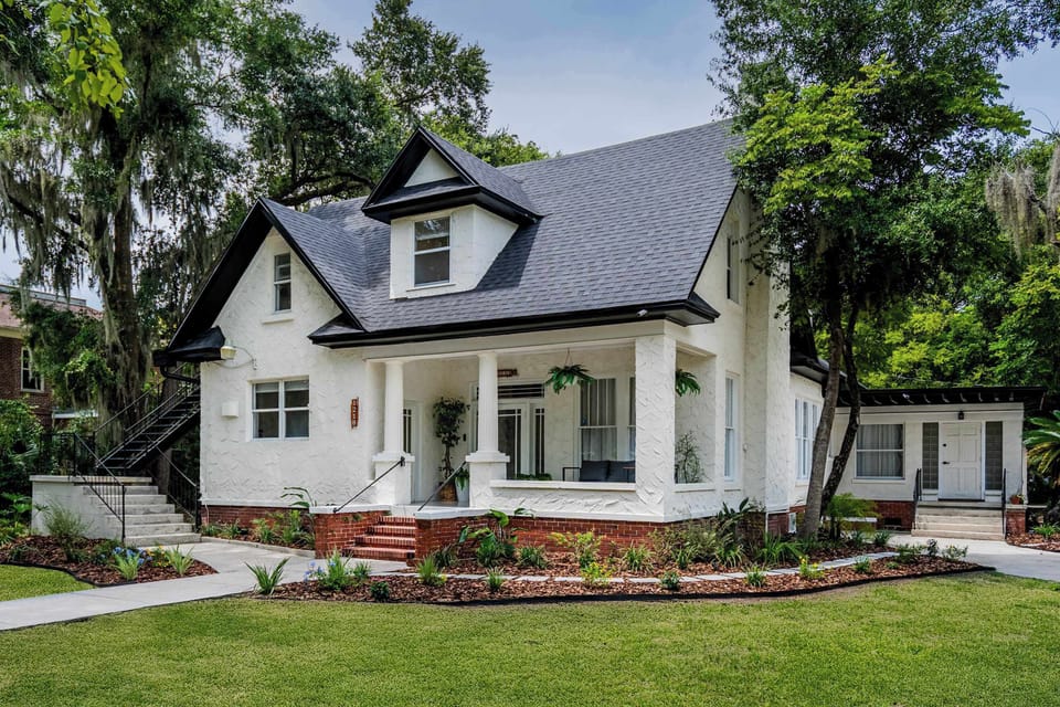 Charming White Cottage Oasis – Historic Character Meets Modern Luxury.