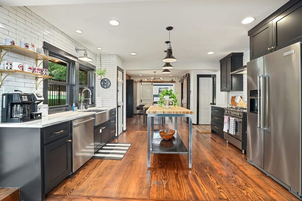 Our kitchen and d room feature more large windows that peer to our epic back yard space, brand new appliances, and is fully s with all amenities for your crew. Includes 8-person dining table, large kitchen island, and bar window seating.