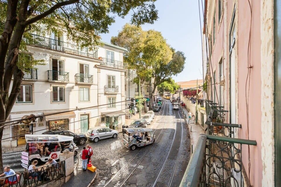 30 ❤️StayInLisbon.pt – Views over a classic Lisbon street with passing trams