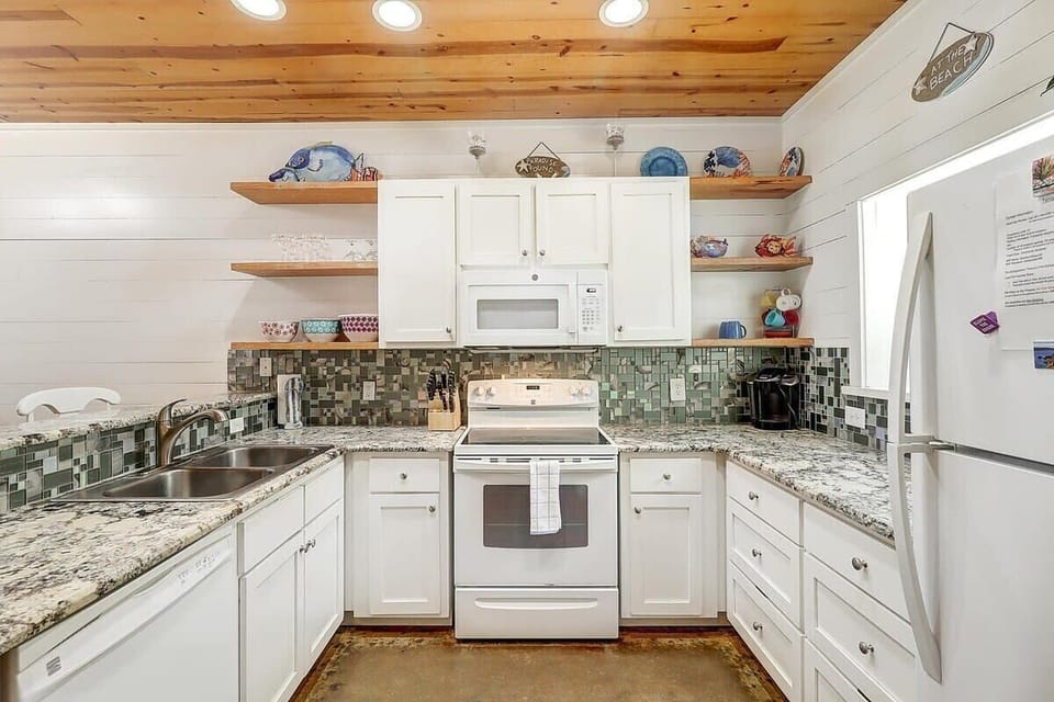 Fully stocked kitchen is primed for hosting BBQ cookouts and crafting delightful meals.