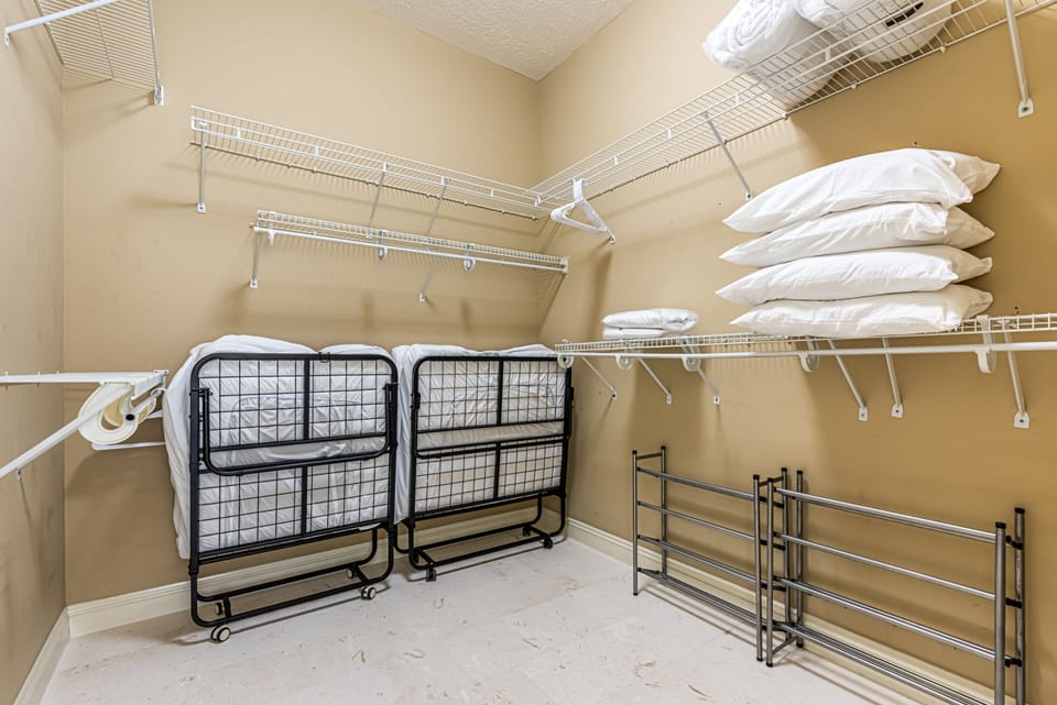 Master Closet with Extra Rollaway Beds