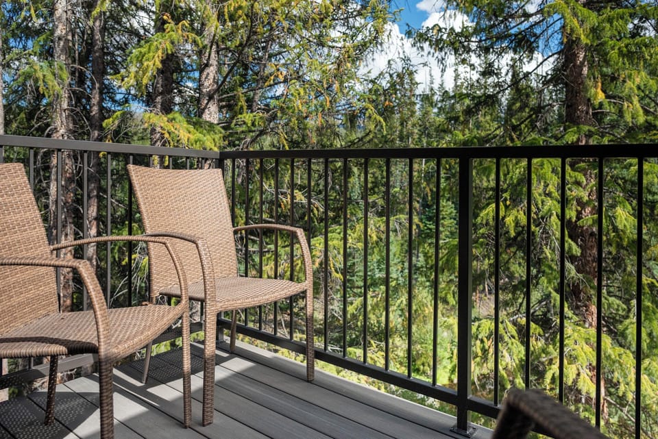 Step onto your private balcony and breathe in the fresh forest air while relaxing in comfortable wicker seating.