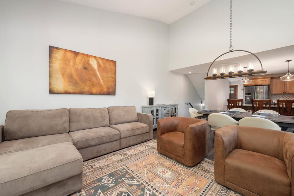 Sink into plush seating where modern comfort meets rustic charm, perfect for unwinding after your adventures.