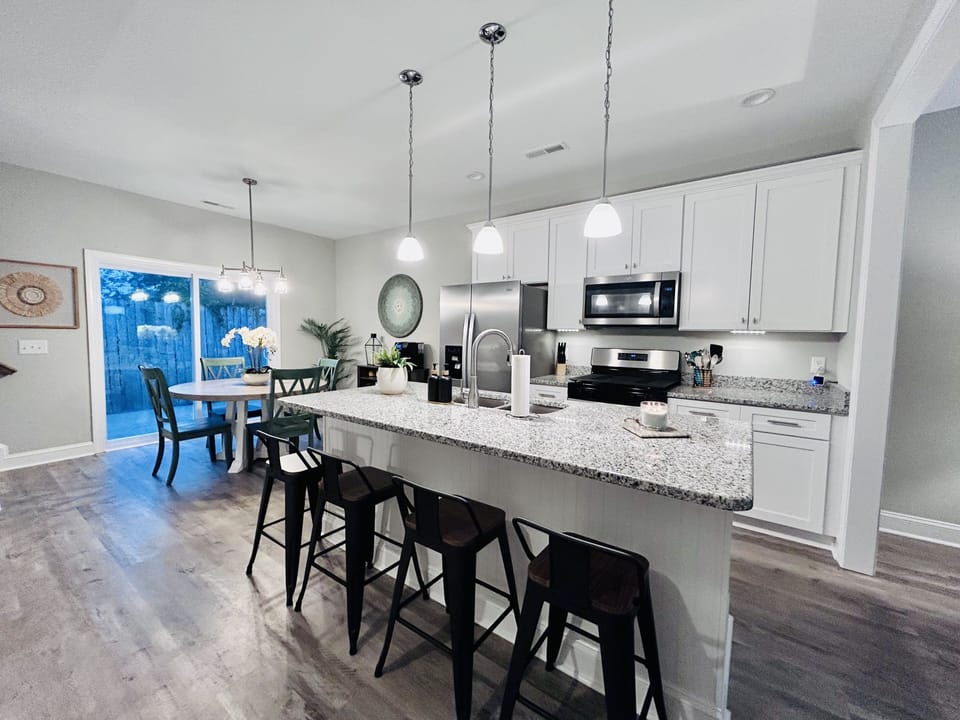 Open floor plan is ideal for entertaining and group meals with seating for eight