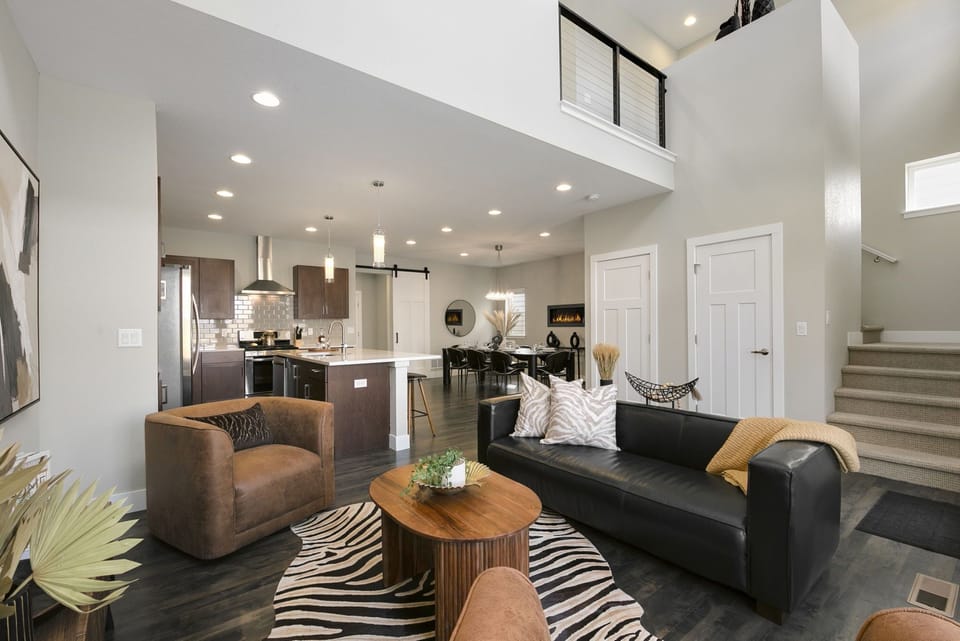Cozy Chic Living Area | Plenty of comfortable seating and gorgeous natural light!