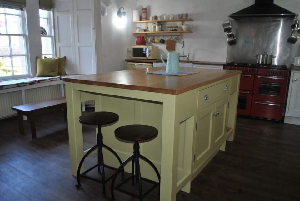 A striking central island makes the kitchen a sociable space