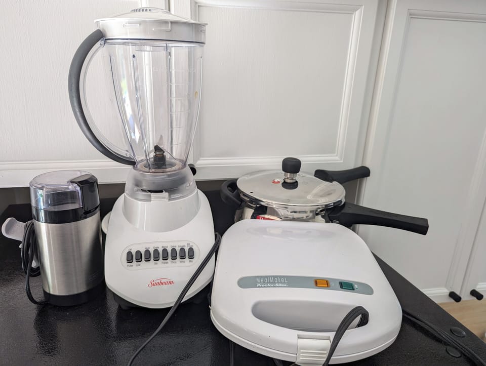 Pressure cooker, blender, sandwich maker and coffee grinder 