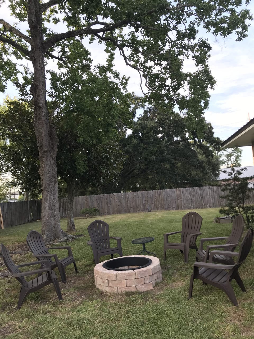 Large Backyard with privacy fence & firepit.