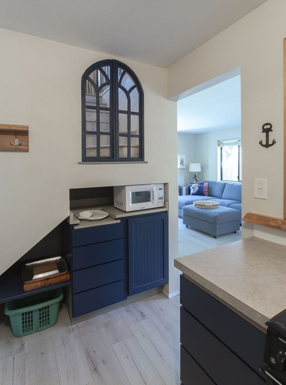 The old church window frame allows for afternoon light to fill the kitchen.