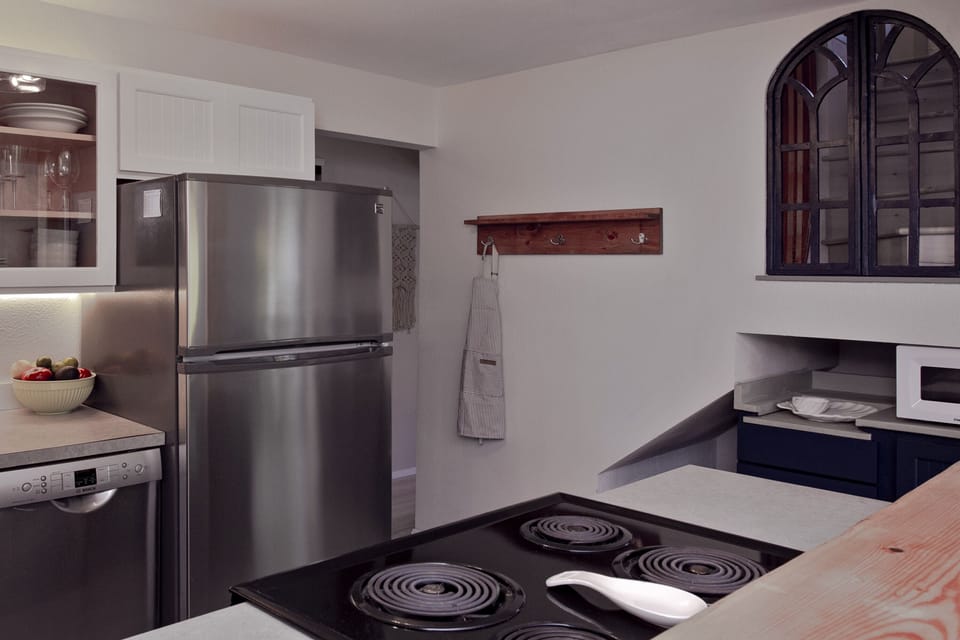 Full kitchen includes dishwasher, fridge, stove, range, and microwave.