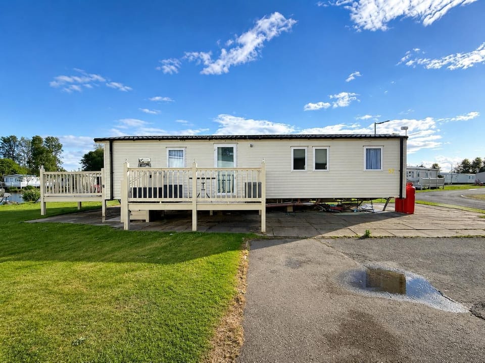 Picture yourself sipping coffee on the decking of a caravan with lake views, the ideal setting for a romantic getaway UK at Southview Holiday Park Lincolnshire.