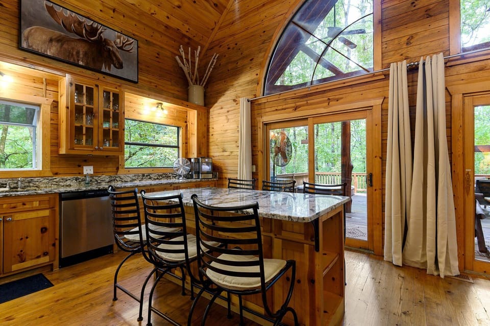 "Morning light and musings blend beautifully at the breakfast bar, where the kitchen's warmth meets functionality."