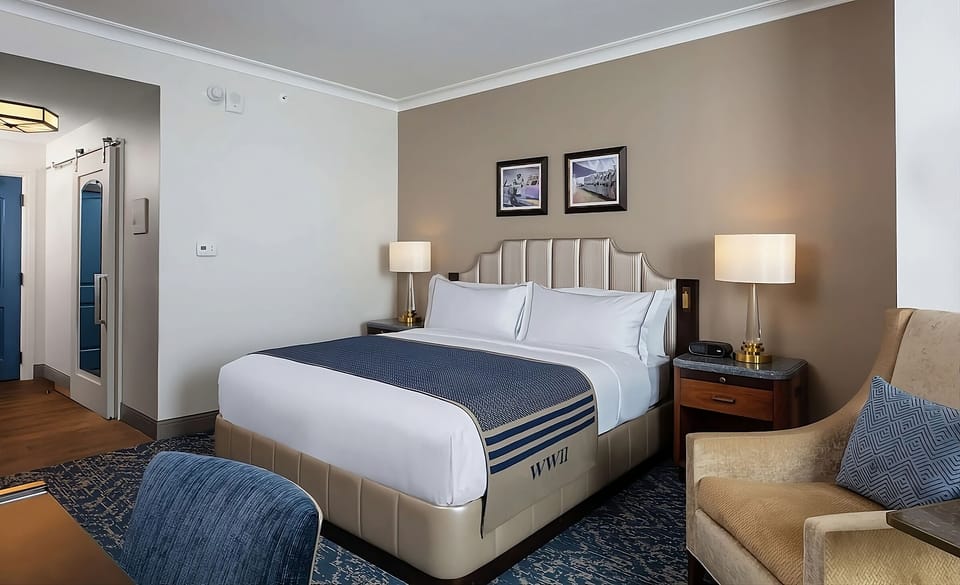 Recharge in a calm room with inviting seating and warm lamps.