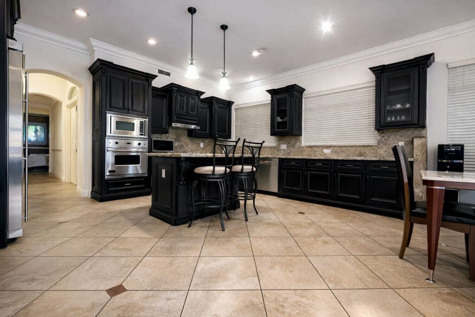 Open large kitchen, stainless steel appliances