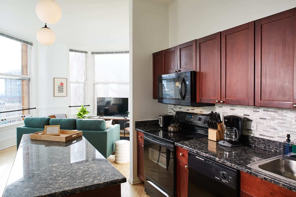 Gourmet kitchen with island is open to the living room