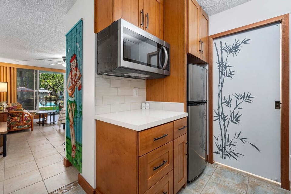 Under-cabinet microwave. Pocket door to bathroom.
