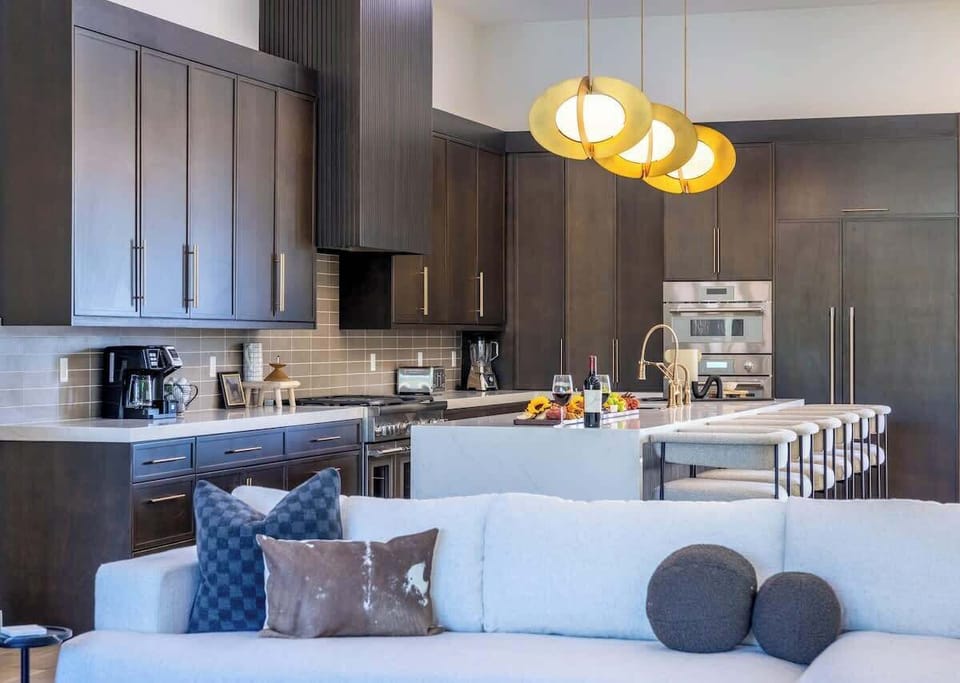 Elegant dining area with modern lighting and seating for large groups.