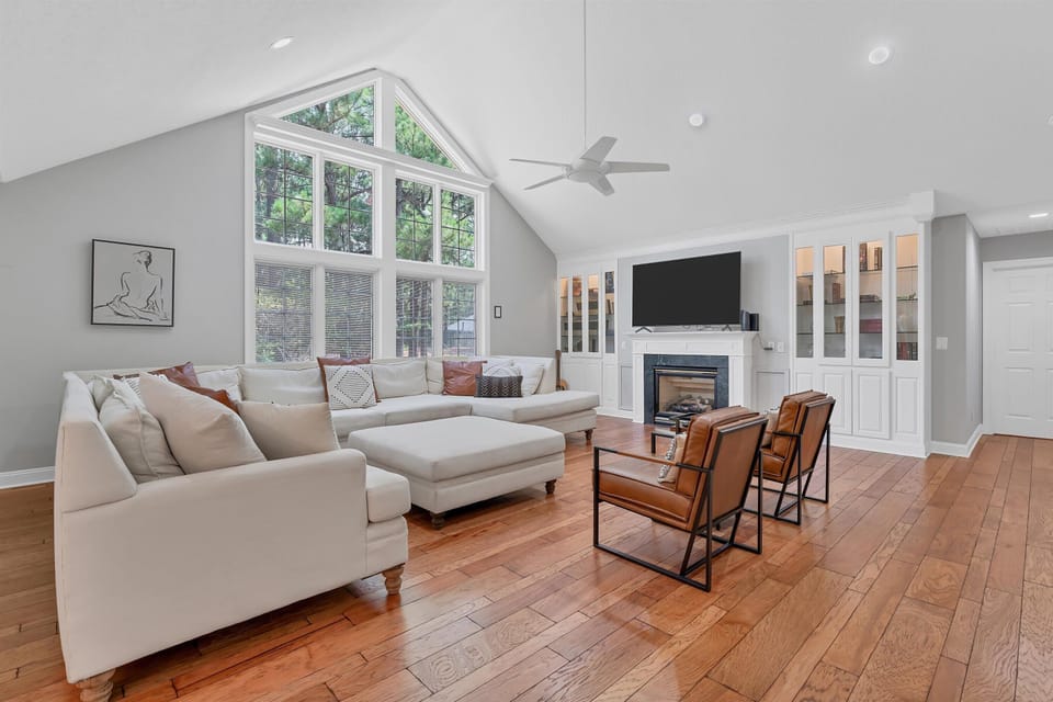 Spacious living room, comfortable and inviting gathering space to relax, reconnect, or catch the game (fireplace inoperable).