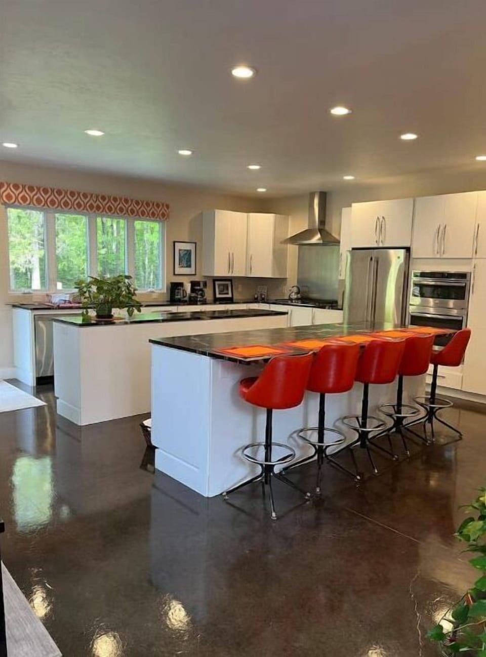 The kitchen with heated concrete floors and granite countertops. Fully equipped.