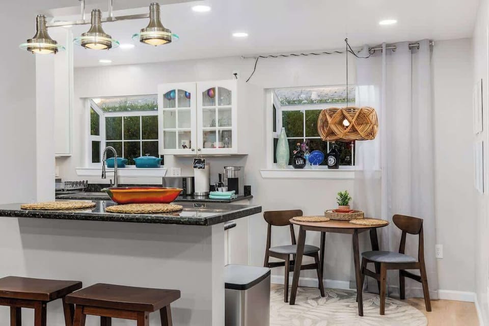 Bar stools and dining nook in kitchen