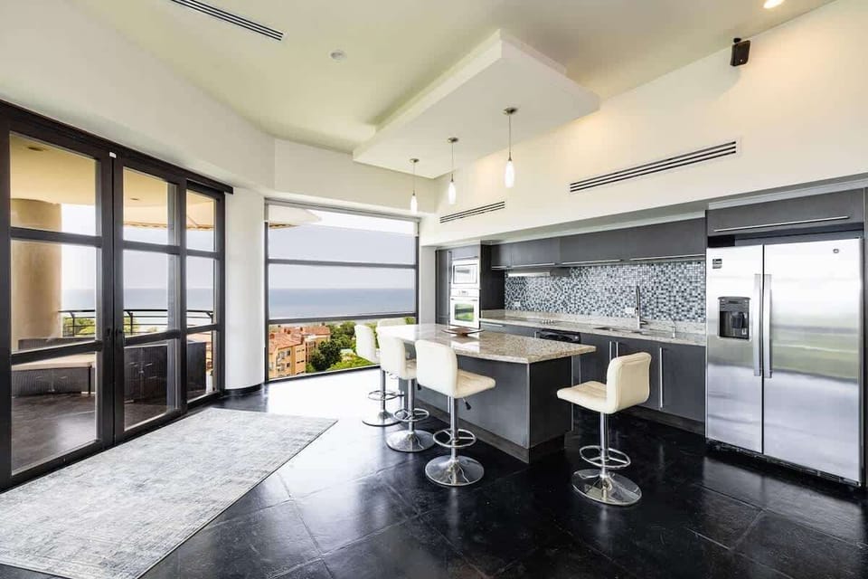 Open kitchen, stainless steel appliances, ocean view