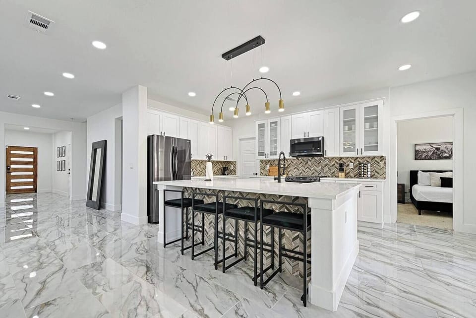 Large open concept with large island for seating for 4