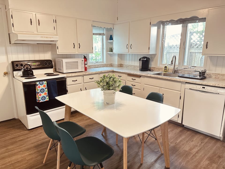 Kitchen comfortably seats 4 adults. 
