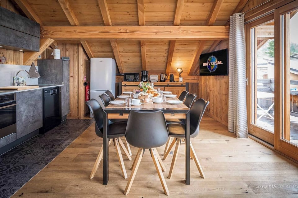 The living area is light and airy, with vaulted ceilings in the eaves of the building..