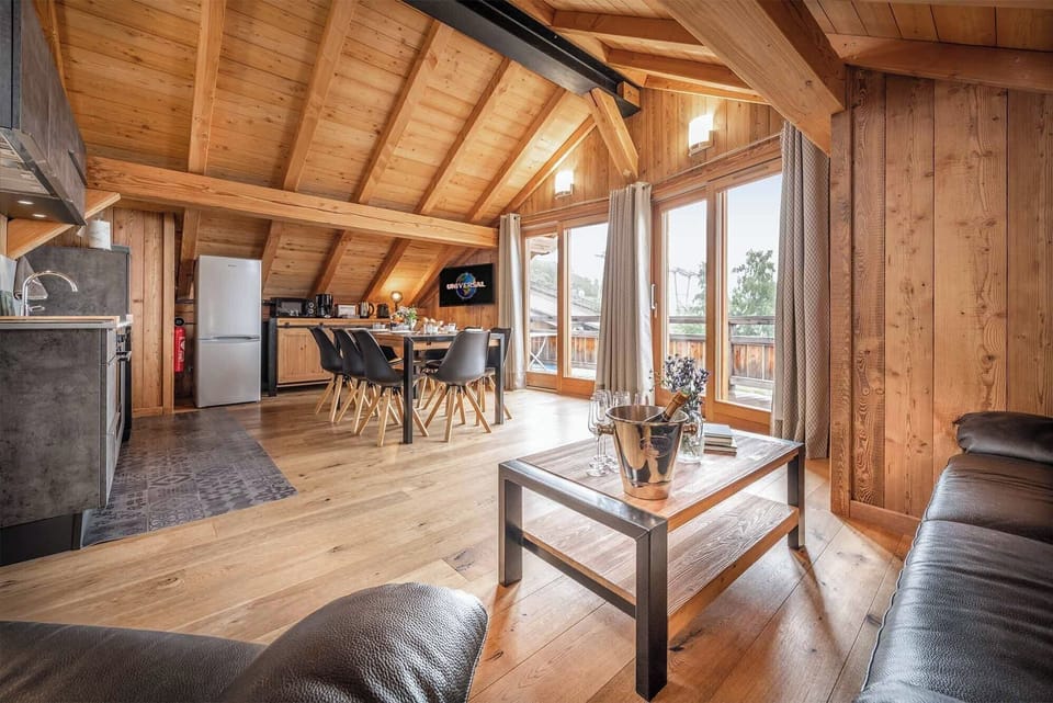 Outside of the living space is a large balcony from which there are stunning views of the surrounding mountains and a great spot to enjoy an après-ski drink.