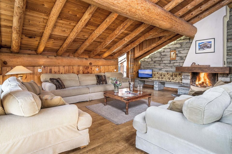 Experience comfort and serenity in our elegantly appointed living room, complete with a wood-burning fireplace.