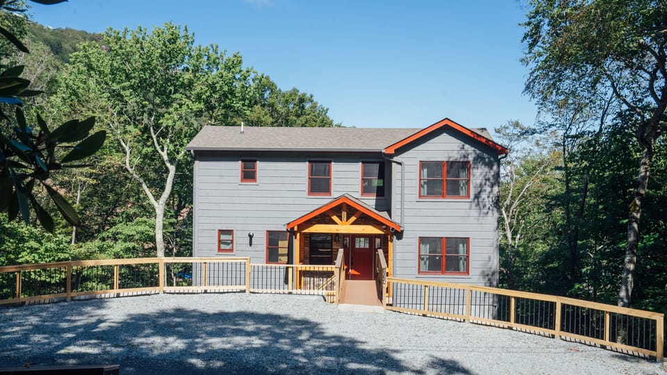 Charming mountain home with modern design and scenic surroundings.
