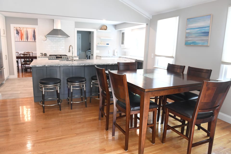 High top table seats six, kitchen island seats four