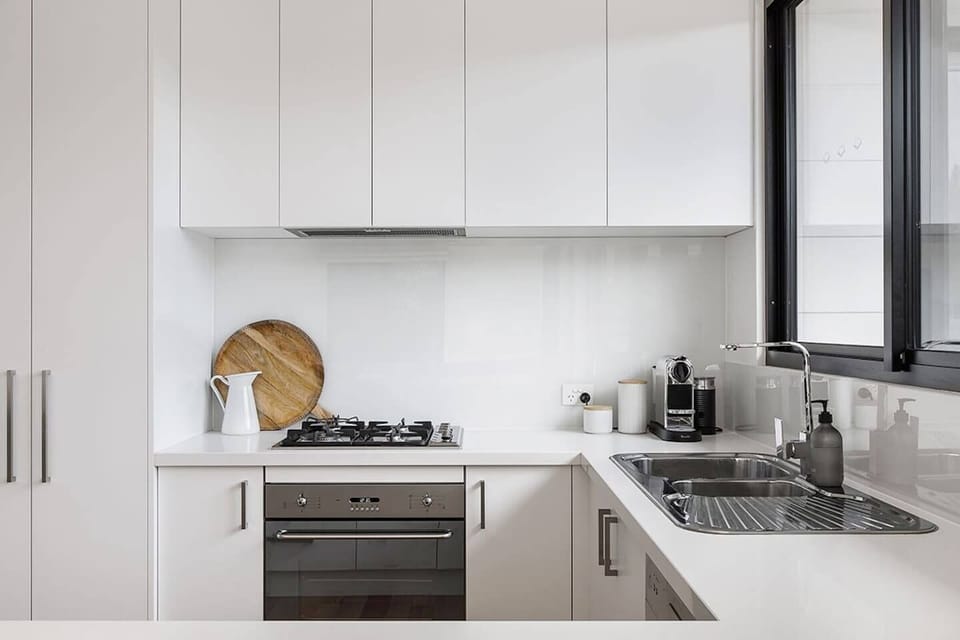 Make use of a gas cooktop, sleek oven, double sink, double-door fridge, dishwasher, microwave and a Nespresso machine
