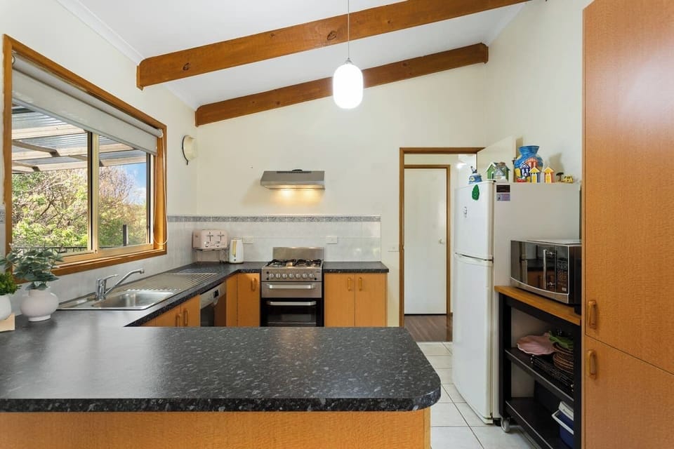 A full kitchen allows guests to cook at home on modern appliances and utensils.
