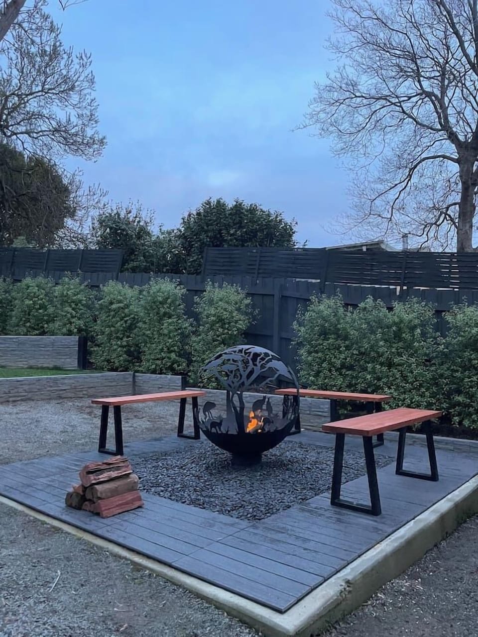 Cosy up around the outdoor fire pit in the cooler months.
