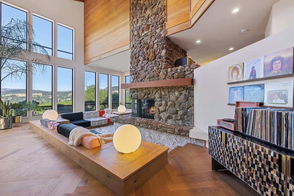 Sunken living room with gas fireplace and large collection of records 