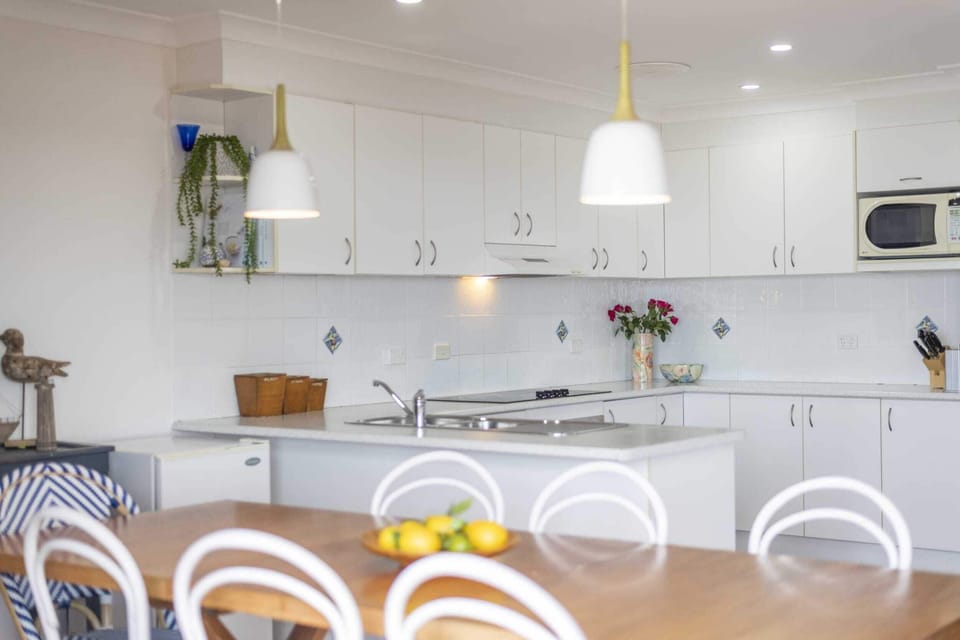Bimbajong Main Beach - Coast accommodation in Yamba town with Ocean views - Open plan kitchen, living & dining with ocean views