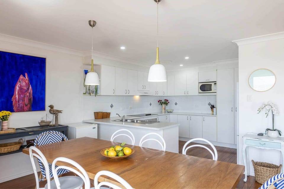 Bimbajong Main Beach - Coast accommodation in Yamba town with Ocean views - Open plan kitchen, living & dining with ocean views