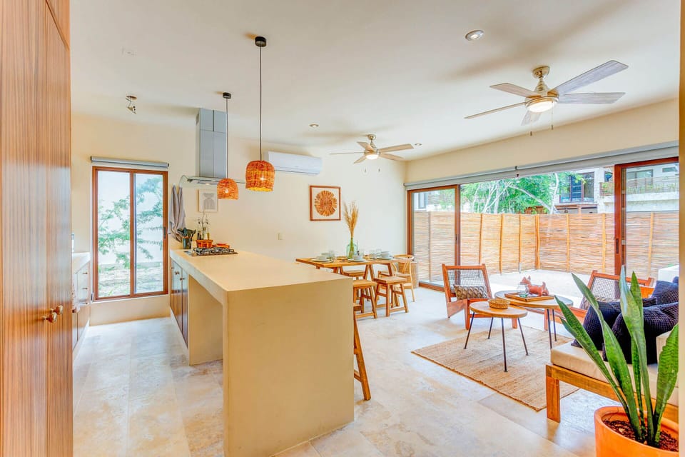 Floor-to-ceiling sliding doors you can open, extending the space to the outdoor patio
