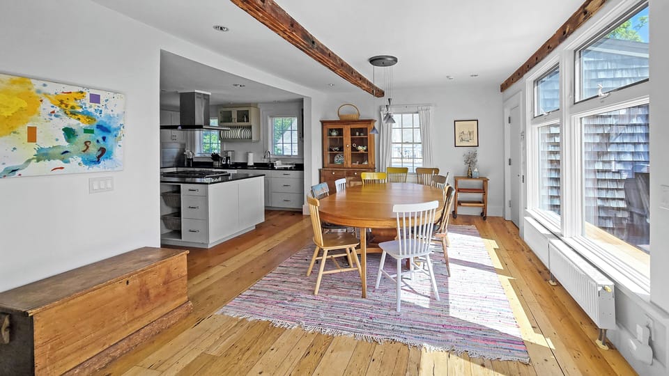 Living room opens to dining area and kitchen beyond