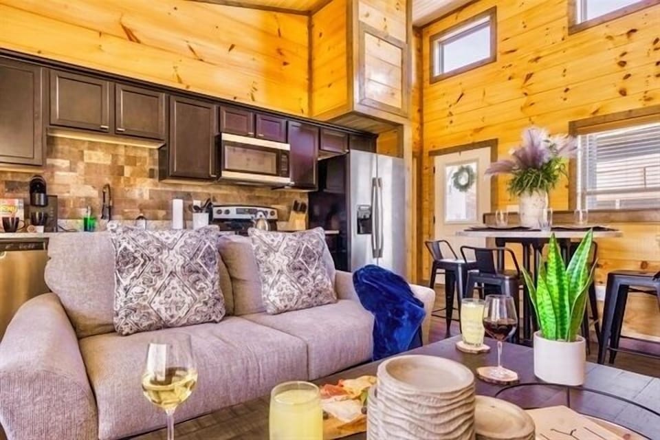 Settle into the soft sofa with a blanket and a warm drink as golden sunlight fills the room. Conversations flow easily here laughter mingling with the crackle of the fire and the scent of pine that makes you feel instantly at home.