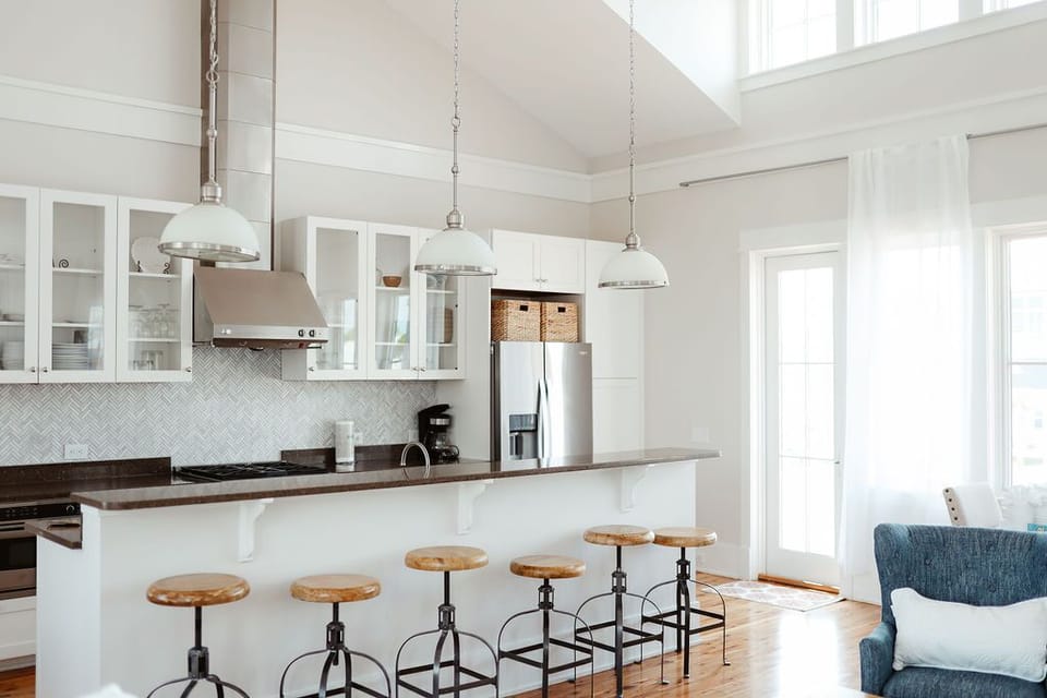 Indoor main kitchen/bar. Door leads to upstairs sun porch with sunset/water view