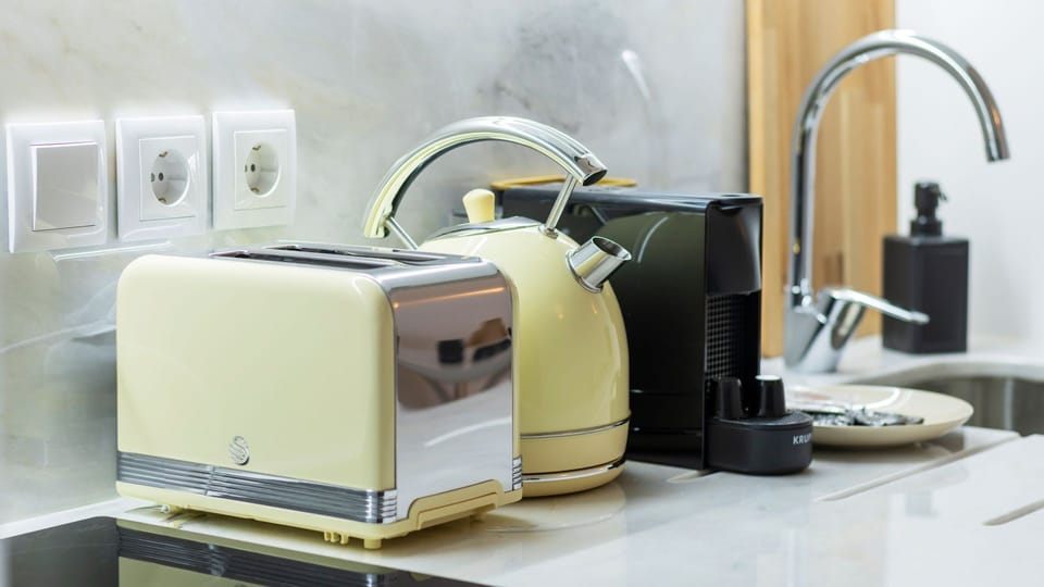 Start your day right with a freshly brewed coffee from the espresso machine and perfectly toasted bread, enjoying the convenience of a fully equipped breakfast station. All the essentials are at your fingertips for a delightful morning routine.